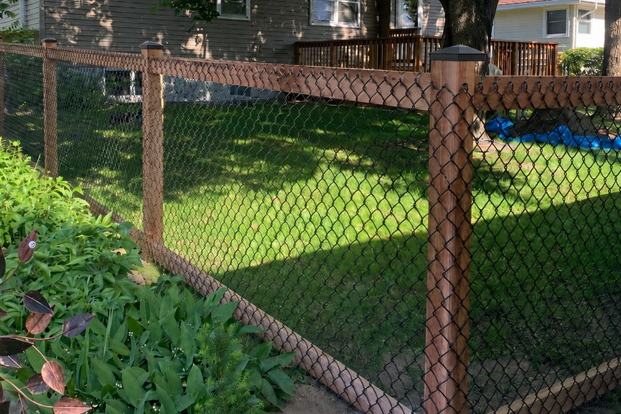 Four-foot TimberLink fence with wood posts, exterior rails, black chain link and black post caps