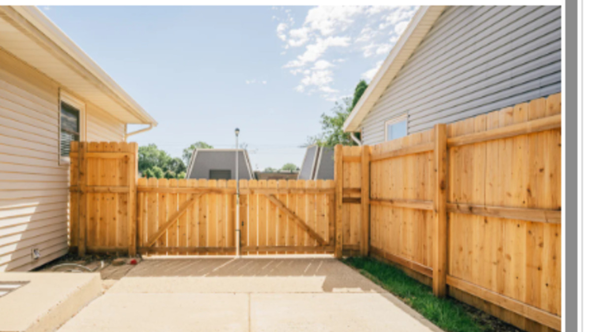 Dog-eared wood privacy fence at a residential home
