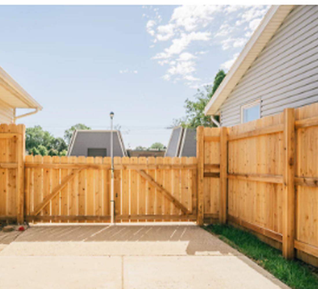 New residential wood privacy fence and gate