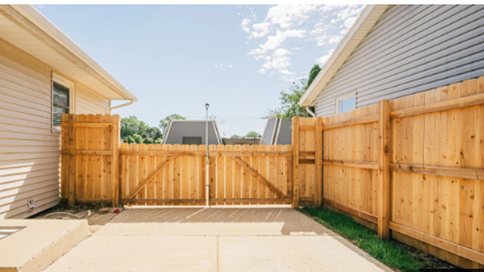 Dog-eared wood privacy fence at a home